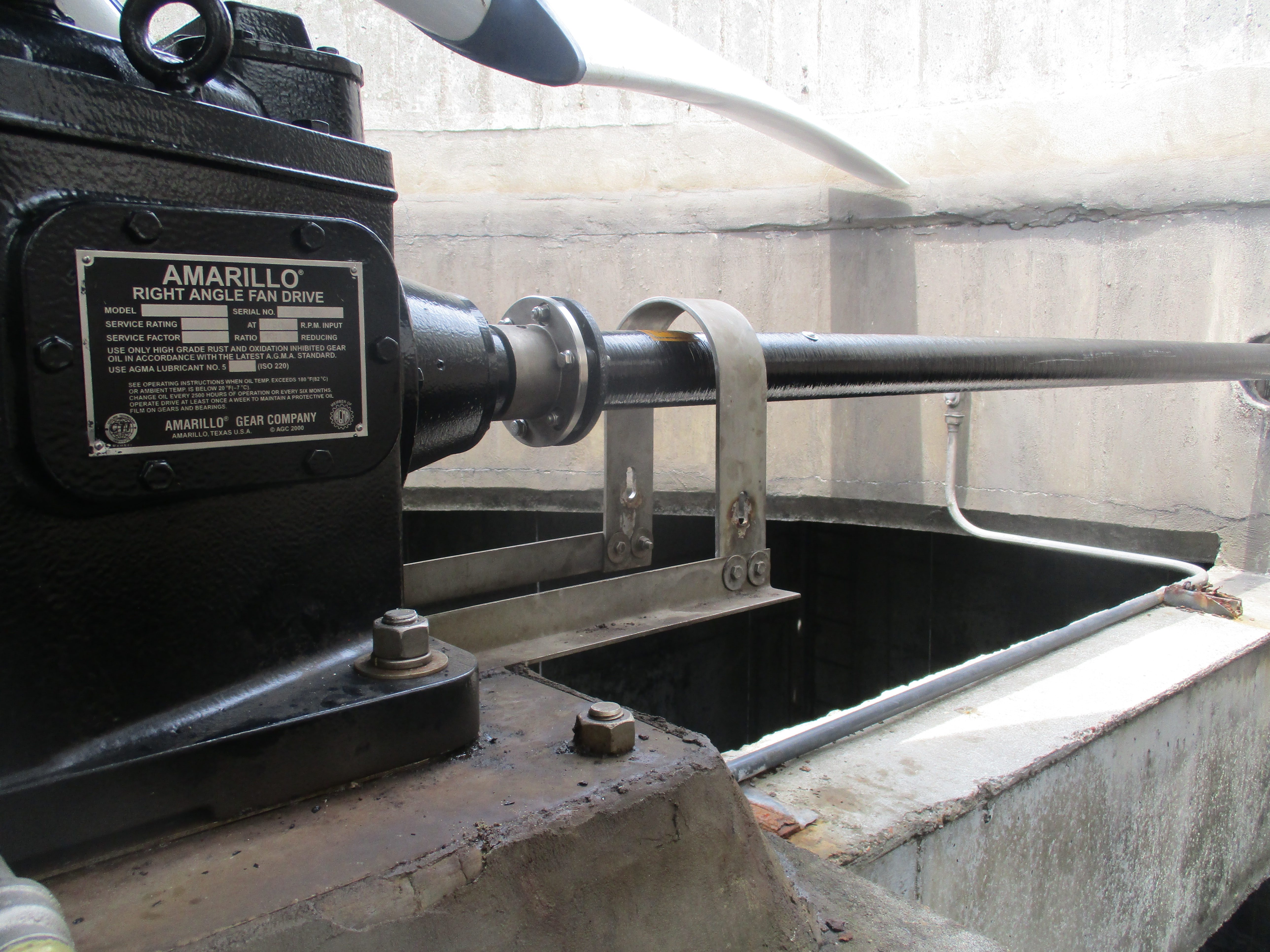The nameplate of an Amarillo Gear Company right-angle fan drive on a cooling tower gear reducer.